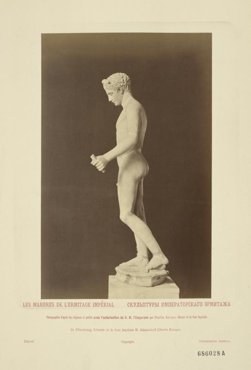 Nude man with wings on head, holding stick