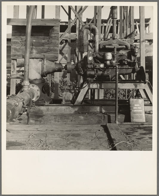 This pumping plant for irrigation is powered by a natural gas engine which operates on cost of about 1/2 the cost of electricity, Tulare County, California