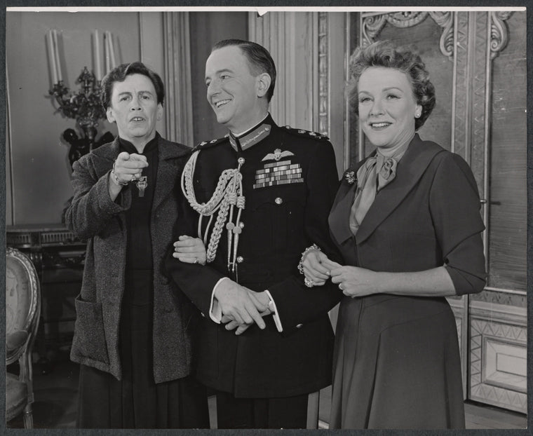 Maurice Evans (center) and unidentified cast members in the stage production The Apple Cart