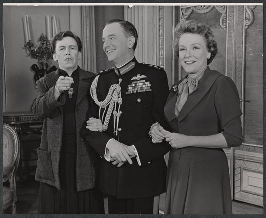 Maurice Evans (center) and unidentified cast members in the stage production The Apple Cart