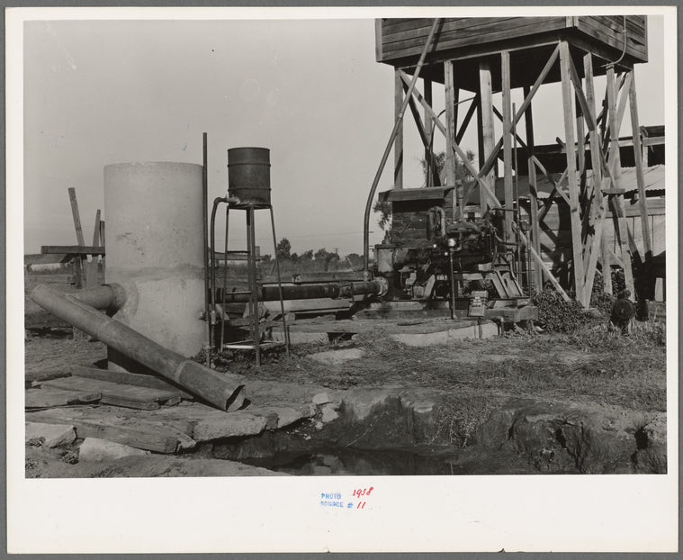 This pumping plant for irrigation is powered by a natural gas engine which operates at about half the cost of electricity. Tulare County, California
