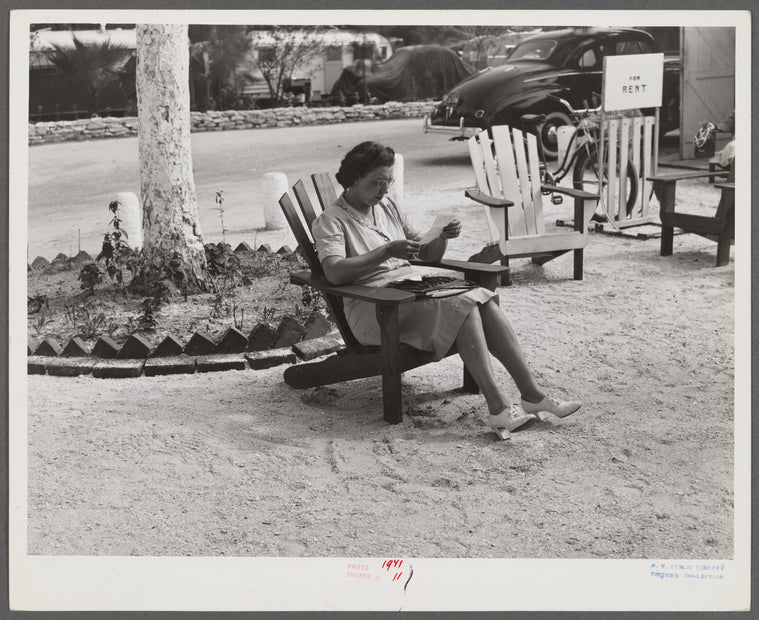 One of the occupants of Sarasota trailer park reading her mail. Sarasota, Florida.