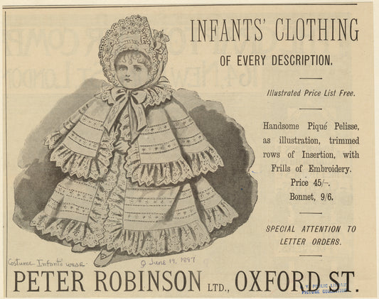 Infant wearing piqué pelisse and bonnet