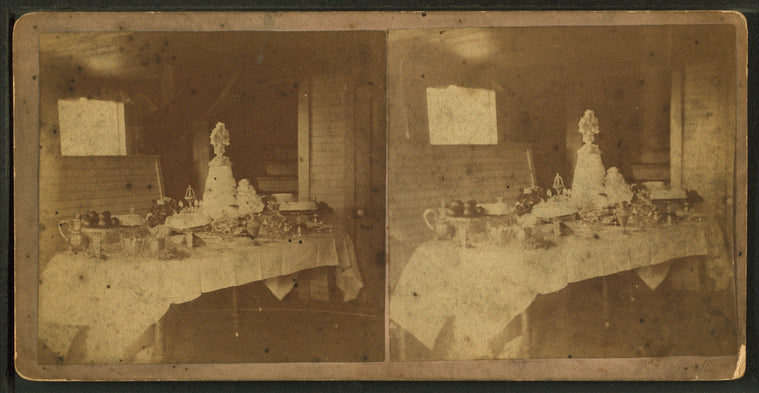 Table set with a wedding cake and fruits, Victor, Iowa.