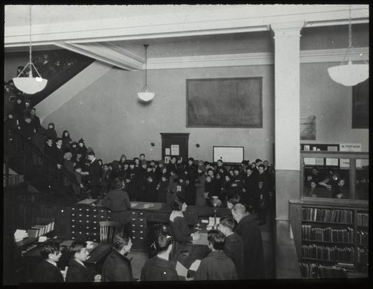 96th Street, Adult room, 1923, showing people at desk, and stairway filled with people