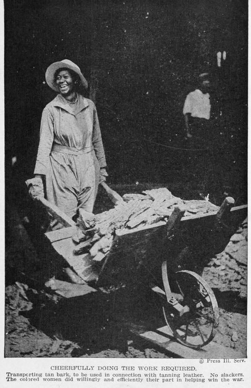 Cheerfully doing the work required; The colored women did willingly and efficiently their part in helping win the war.