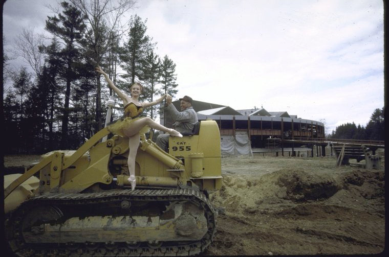 New York City Ballet dancer Violette Verdy poses on a tractor amidst the construction of the new Saratoga Performing Arts Center (Saratoga)