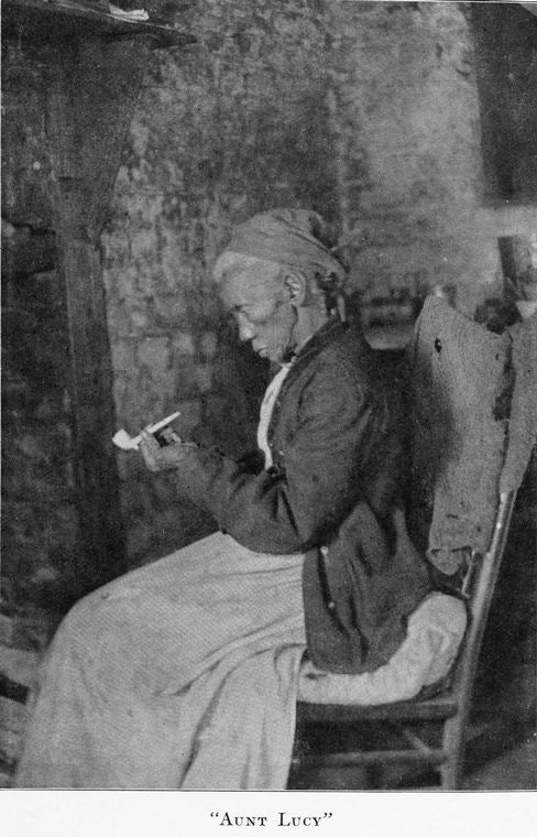 Aunt Lucy.  She is the oldest of the former slaves at Hermitage Plantation, being nearly one hundred.  The cabin shown is also one of the oldest.