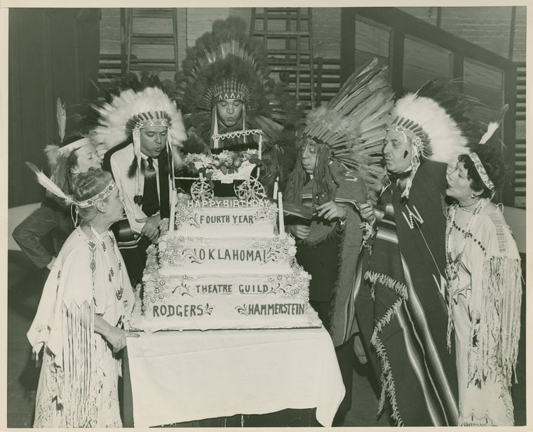 Theresa Helburn, Agnes De Mille, Oscar Hammerstein II, Rouben Mamoulian, Richard Rodgers, Lawrence Langner and Armina Marshall (Theatre Guild and creative team) celebrating the 4th anniversary of Oklahoma! on Broadway